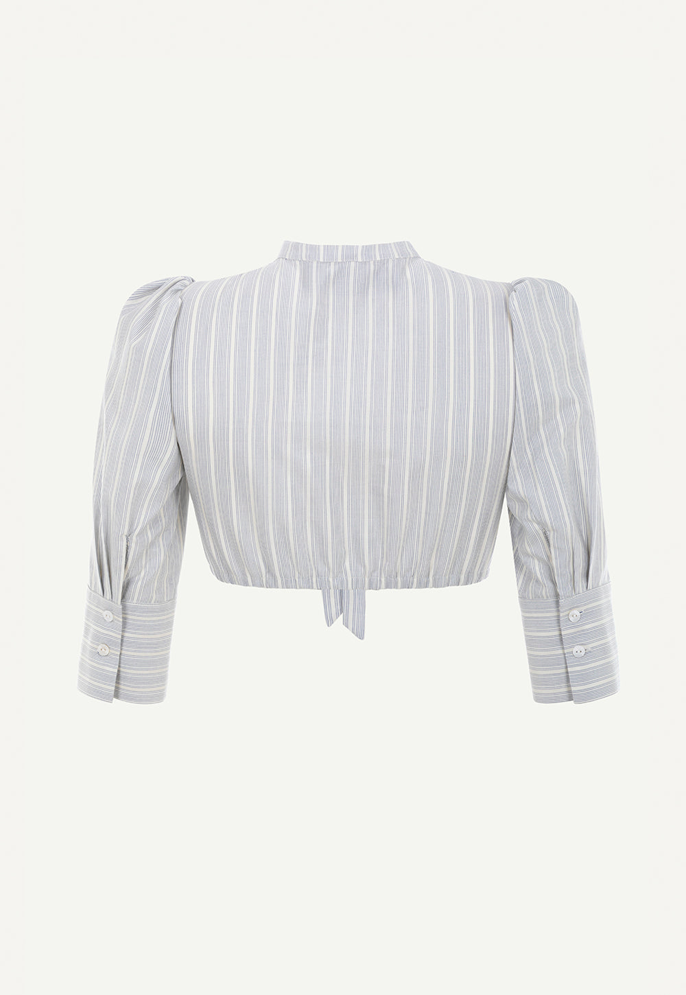 Back view of the Fanny Blouse Blue Stripes in a silk-cotton blend with gathered sleeves, buttoned cuffs and elasticated hem.